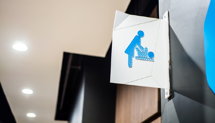 Sign for Baby Changing Station Above Restroom