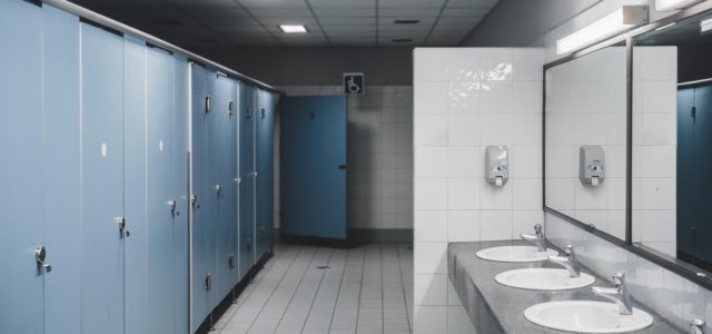 Bathroom Rust Stains: 5 Steps to Remove Them and Restore Your Commercial Restroom Public bathroom with sinks and bathroom stalls