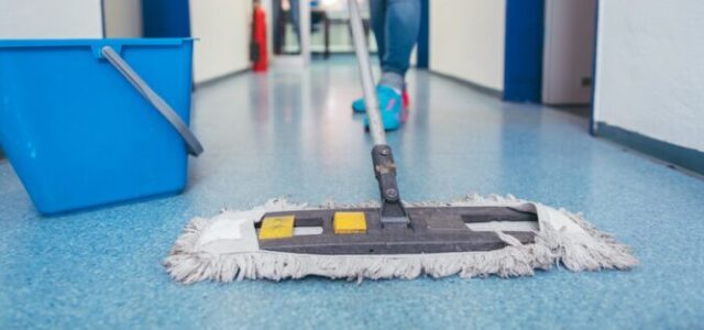 Dry mop on blue floor