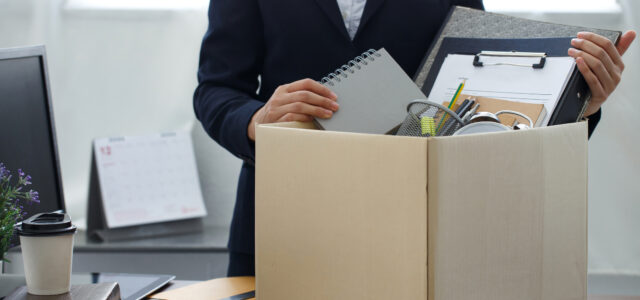 Resignation concept.Businesswoman packing personal company belongings when she deciding resignation change of job or fired from the company.