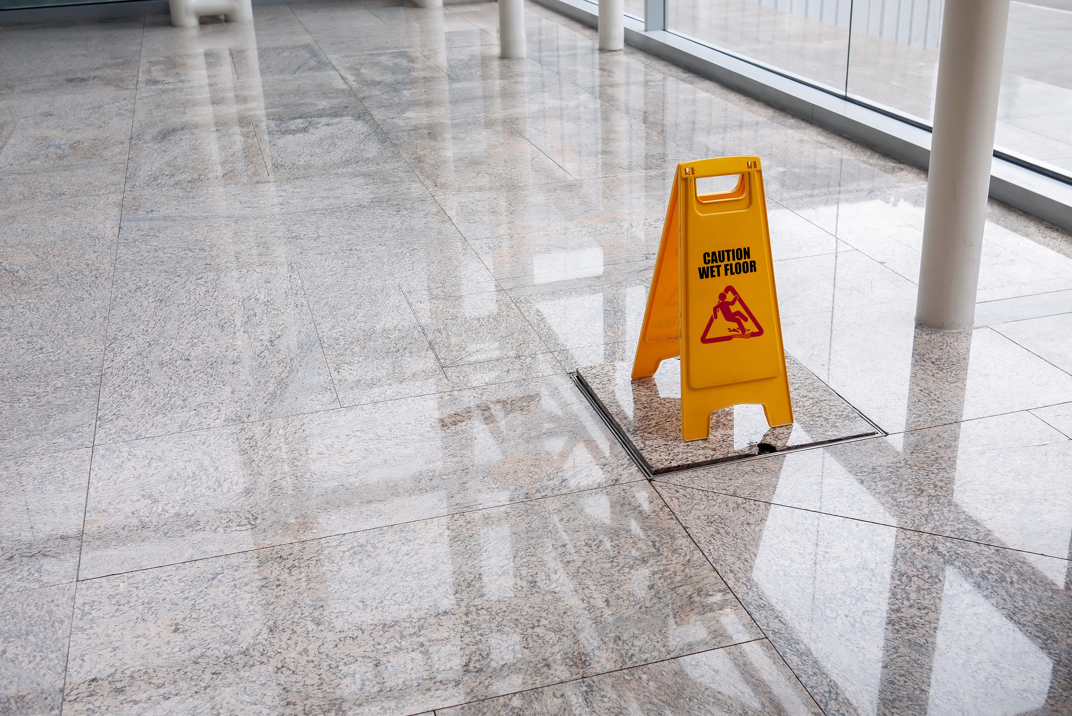 wet floor sign on lobby